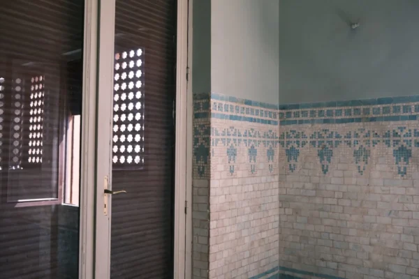 a door with a tile wall