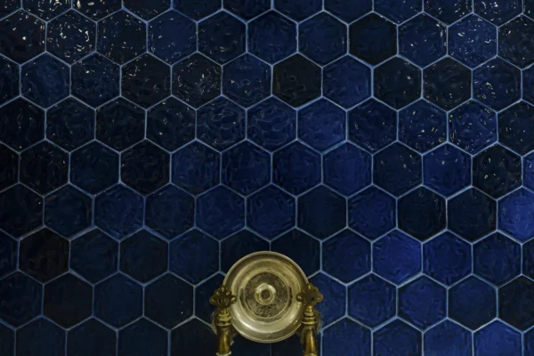 blue tiles and copper fountain in a Turkish bath