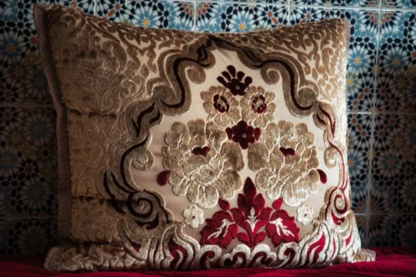 brown and white floral throw pillow