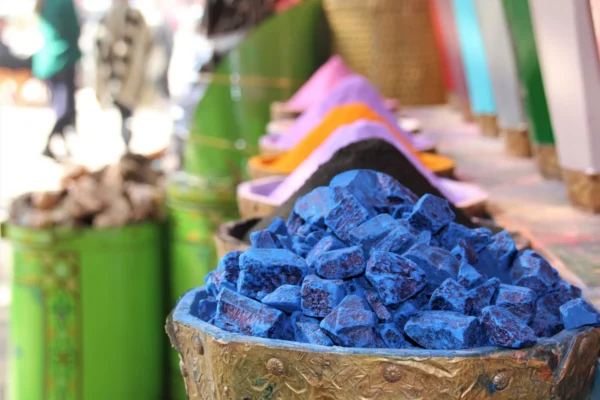 blue and white stones in brown woven basket