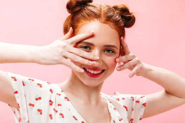 a woman with her hands on her face