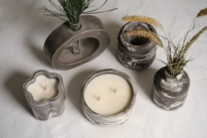 A couple of candles sitting on top of a table